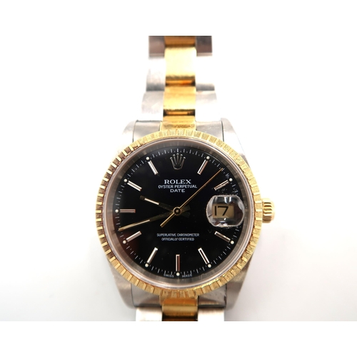 296 - A Rolex Oyster Perpetual Date wristwatch, the black dial with baton markers date aperture at 3 o'clo... 