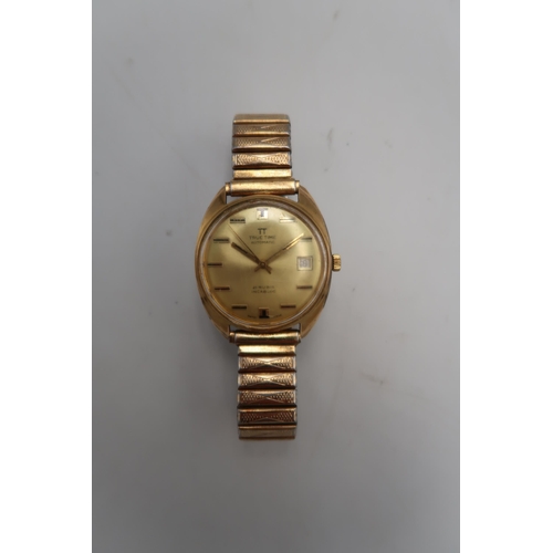 302 - A gentleman's True Time automatic gold plated wristwatch with matching bracelet strap, the gold colo... 