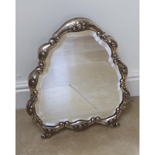 330 - A Continental silver cartouche shaped mirror, the frame decorated with floral sprays, 50cm high x 42... 