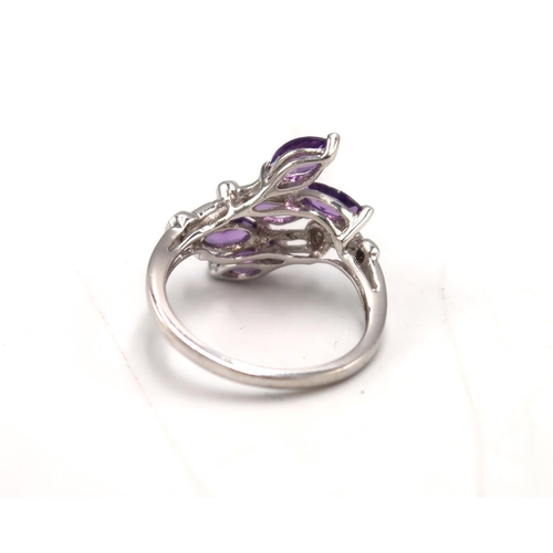 34 - A 9ct white gold, hallmarked amethyst and diamond dress ring, size K, 2.6g, and a 9ct gold and ameth... 