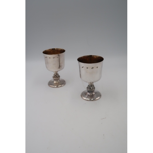 349 - A pair of late 20th century silver goblets of simple form, with Celtic detail to the knopped stems, ... 