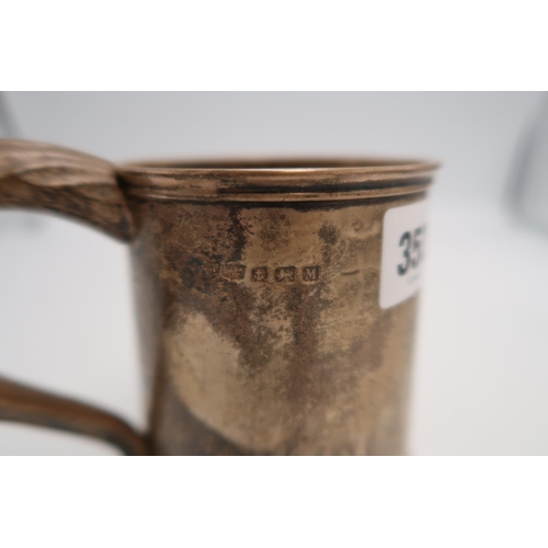 353 - A silver tankard, Birmingham 1936, 12cm high, 8.65toz.