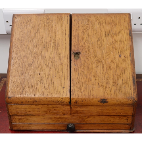 431 - An oak cased early 20th century correspondence box, two doors over drawer.