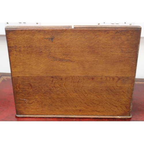 431 - An oak cased early 20th century correspondence box, two doors over drawer.