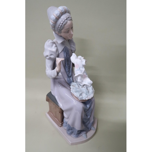 437 - A Lladro figurine 5126 'Sewing a Trousseau, 29cm high