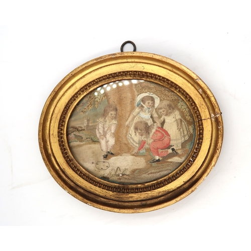 446 - A pair of framed oval Regency silk embroideries, scene depicting children playing.