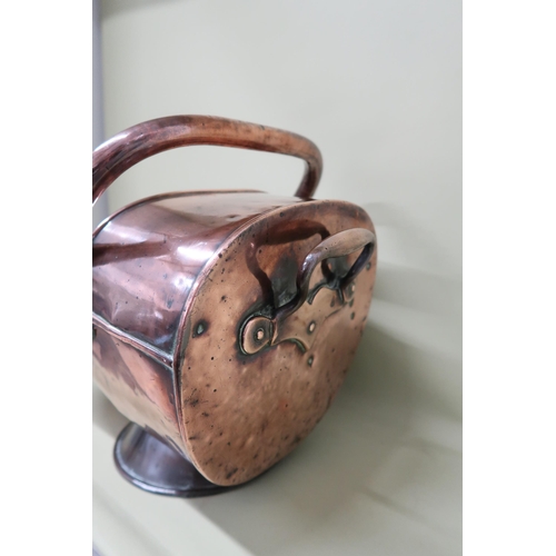 450 - A copper helmet shaped coal scuttle - Depth 38cm x Height 30cm x 28cm - condition commensurate with ... 