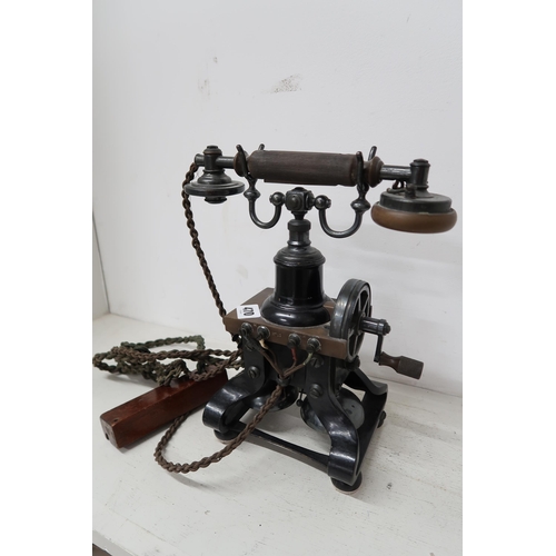 470 - A vintage cast iron Ericsson skeleton telephone. Missing Horn. 30cm high.