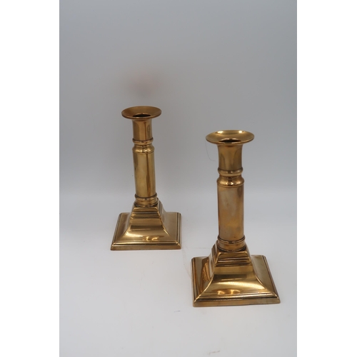 473 - A pair of brass extendable candlesticks marked F and Co. and a pair of silver plated candlesticks wi... 