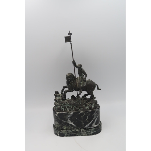 475 - A Bronze sculpture of St George and the Dragon After Bohuslav Schmirch (1845-1901) 28cm high.