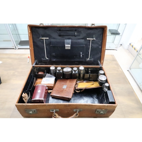 476 - A Leather Travel Case with part fitted interior. 39cm x 66cm x 18cm high.