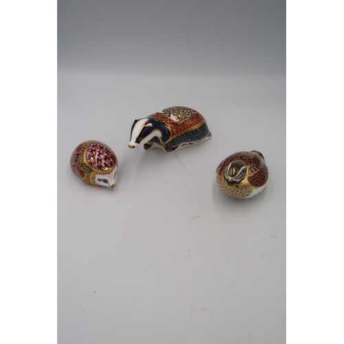 487 - A group of Royal Crown Derby paperweights comprising Moonlight Badger and Orchard Hedgehog, both Exc... 