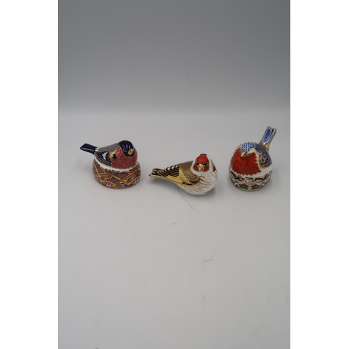 491 - A group of Royal Crown Derby songbird paperweights, comprising Goldfinch, with gold stopper, Robin N... 