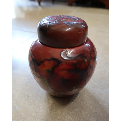 506 - A Moorcroft Flambe ginger jar and lid, of ovoid form, approximately 13cm diameter by 16cm high.