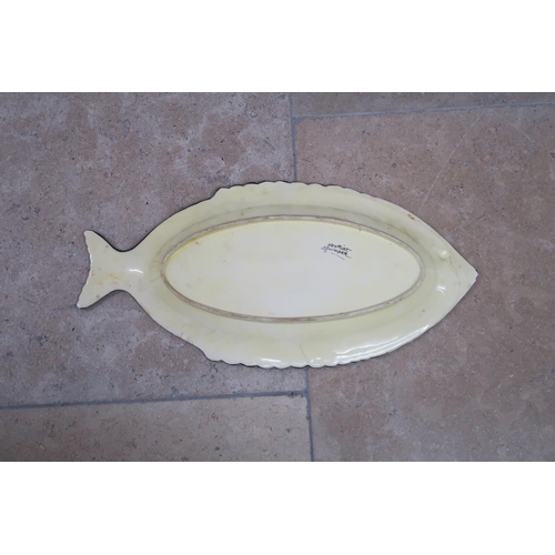 507 - Two French Quimper dishes, both fish and fishing themed, each 61cm long.