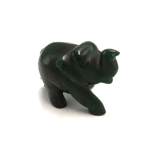 510 - A carved jade elephant, approximately 9 by 5 by 7cm high.