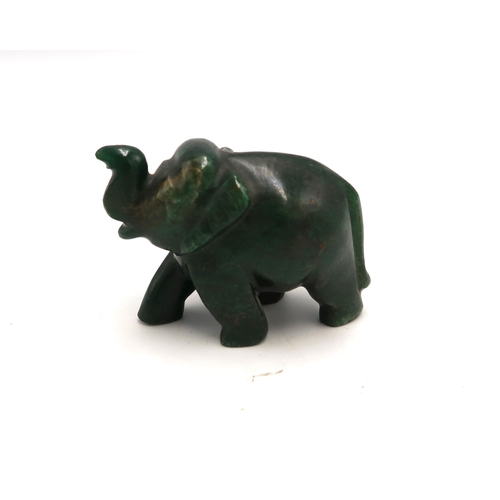 510 - A carved jade elephant, approximately 9 by 5 by 7cm high.