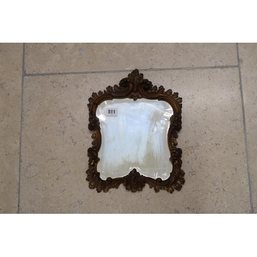 511 - A giltwood surround bevelled mirror with carved frame, 25cm x 32cm - break at top left corner