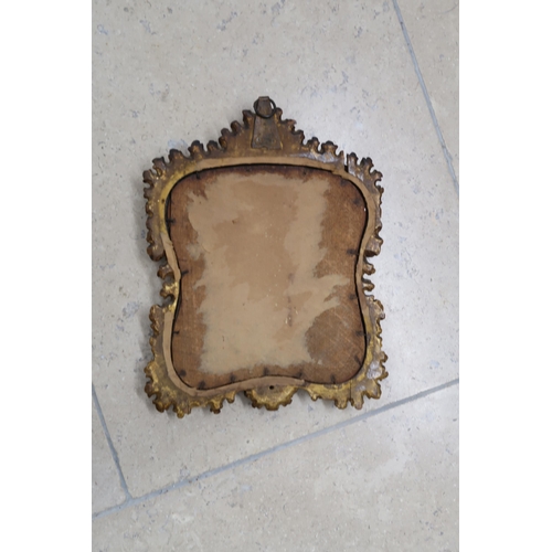 511 - A giltwood surround bevelled mirror with carved frame, 25cm x 32cm - break at top left corner