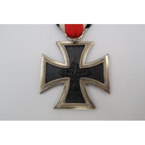 544A - Post 1957 Iron Cross, 2nd Class. Suspended from a length of ribbon, this decoration features stylise... 