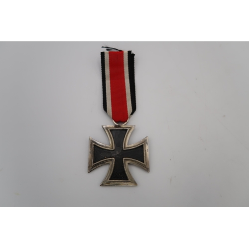 544A - Post 1957 Iron Cross, 2nd Class. Suspended from a length of ribbon, this decoration features stylise... 