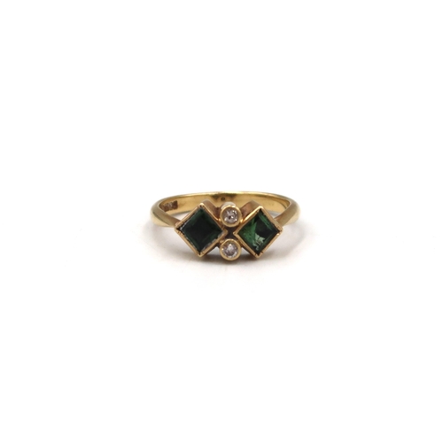 56 - An 18ct square green tourmaline and brilliant cut diamond dress ring. Size R. Weight 4.53 grams.