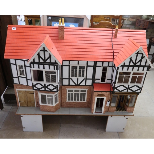 562 - A large Tudor style dolls house and accessories including furniture - Width 170cm x Depth 50cm x Hei... 