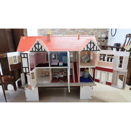 562 - A large Tudor style dolls house and accessories including furniture - Width 170cm x Depth 50cm x Hei... 