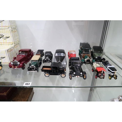 563 - A selection of franklin mint and Matchbox Scale models of vehicles. Models include Rolls Royce, M.G.... 