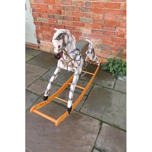 565 - A vintage PC and R Schday Rocking Horse, dapple grey with green saddle and bridle, on bow rocker, 1.... 