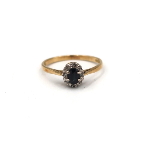 57 - An 18ct oval sapphire and single cut diamond cluster ring. Size R. Weight 2.56 grams