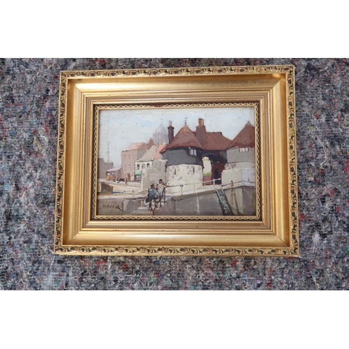 576 - A gilt framed oil on board - Town Scene, figures to foreground - 20cm x 14cm - signed H. Brown