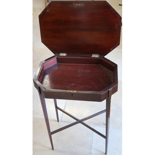 628 - A 19th century mahogany table with a rising top and lift out tray on slender supports 52cm high.