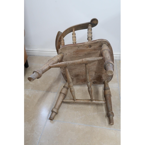 631 - A smokers bow chair, 76cm high x 59cm wide