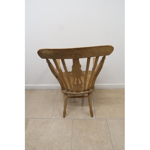 635 - A Grandfather Lyre back  Windsor armchair raised on turned supports joined by H stretcher.
105cm hig... 