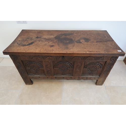 641 - An 18th century oak coffer with a three panel carved front with a nice patina - Width 117cm x Height... 