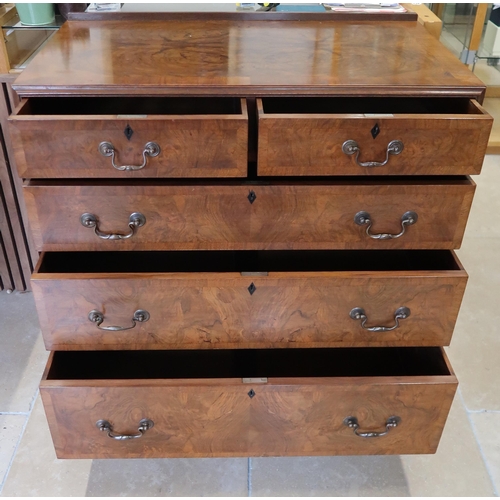 712 - An early Maples Burr Walnut chest of two over three graduated drawers. 92cm wide x 52cm deep x 92cm ... 