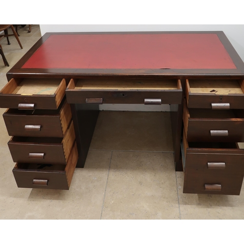 714 - A Circa 1940 eight drawer twin pedestal desk with inset red scriber. 64cm deep x 137cm wide x76cm hi... 