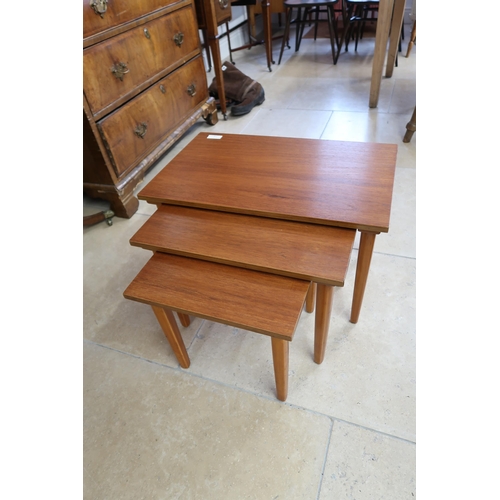 718 - A Circa 1960's/1970's Teak nest of three tables. 61cm wide x 38cm deep x 39.5cm high. (In good condi... 