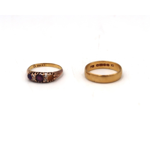 86 - A 22ct H.M. Yellow gold wedding band and a 22ct dress ring, Size M and L respectively. 7.1 Grams.