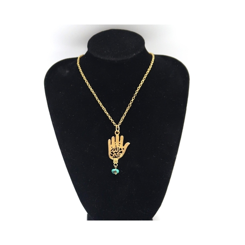 92 - A marked 750 Hamsa pendant on an 18ct gold (Tested) chain.