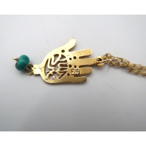 92 - A marked 750 Hamsa pendant on an 18ct gold (Tested) chain.