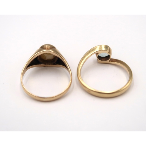 94 - A mabe pearl ring size M 1/2. A blue stone crossover ring, size O. Both stamped 585. Weight 5.28 gra... 