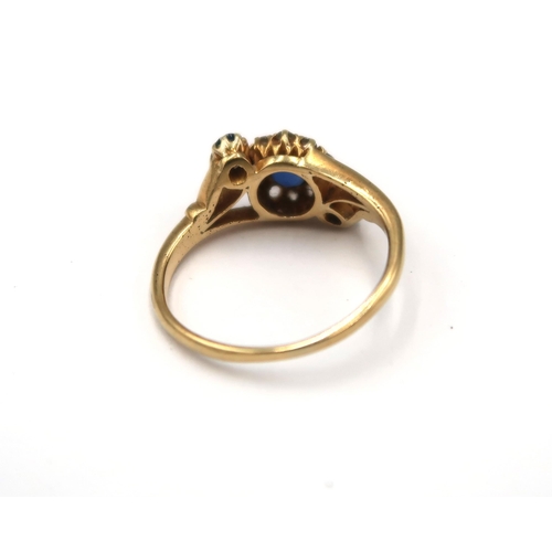 99 - A sapphire and old cut diamond crossover cluster ring. Size L. Tests gold 18ct. Weight 2.50 grams