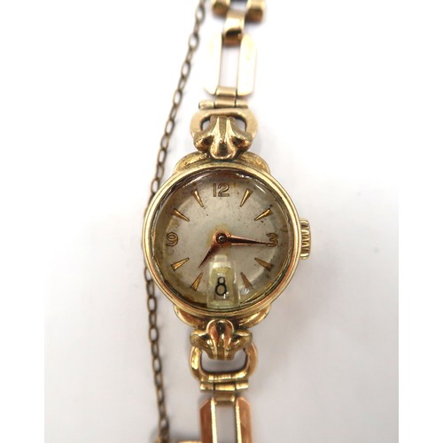 268 - A 9ct yellow gold lady's watch, hall marked, with bracelet strap.