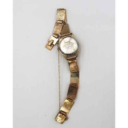 269 - A lady's Pulsar Quartz watch with 9ct gold bracelet strap.