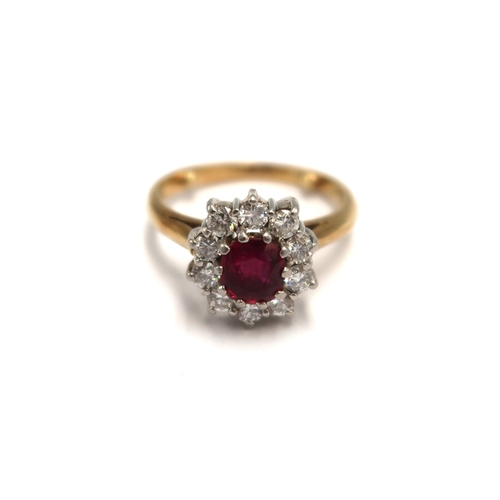  An 18ct yellow gold hallmarked ruby and diamond cluster ring size L - approx weight 5.6 grams