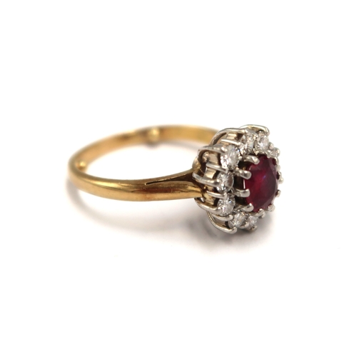  An 18ct yellow gold hallmarked ruby and diamond cluster ring size L - approx weight 5.6 grams