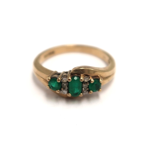  A 9ct hallmarked emerald and diamond dress ring size N - weight approx 3.0 grams