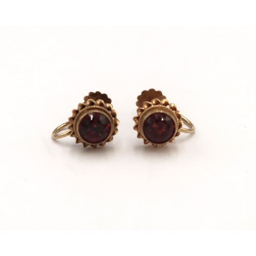  A pair of 9ct hallmarked yellow gold and garnet earrings - approx weight 2.2 grams